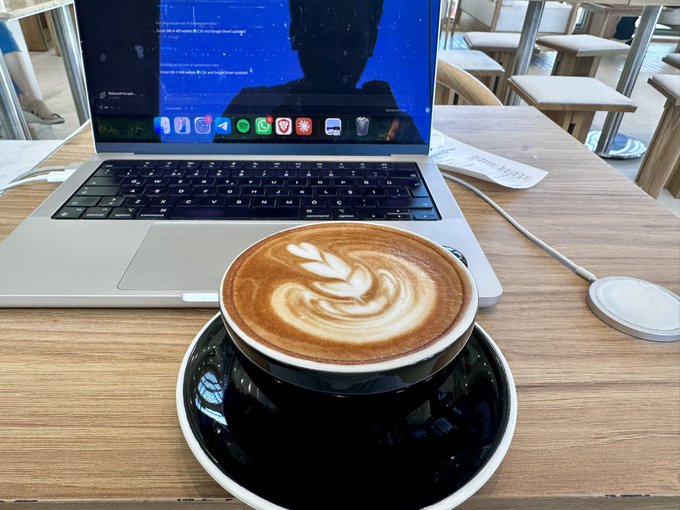 The image shows a laptop computer with an open webpage displaying a person's face, along with a cup of coffee placed next to the laptop. The scene suggests that someone might be working or studying while enjoying their coffee. The caption provided seems unrelated to the main subject matter and does not provide any useful information about the context surrounding the image.