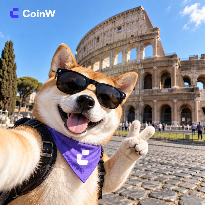 A Shiba Inu dog wearing sunglasses and a purple CoinW bandana making a peace sign in front of the Colosseum in Rome, with the CoinW logo in the top left.