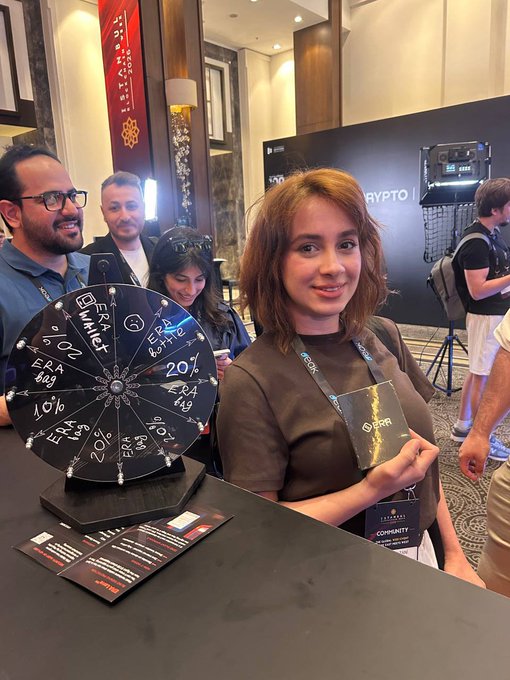 The image features a woman holding up a winning ticket for an event, possibly a casino or a game show, with her name displayed on it. The text "ERA Wallet" can be seen in the image as well. This suggests that she has won a prize related to cryptocurrency or digital assets, and the post is likely promoting this event at Istanbul Blockchain Week.