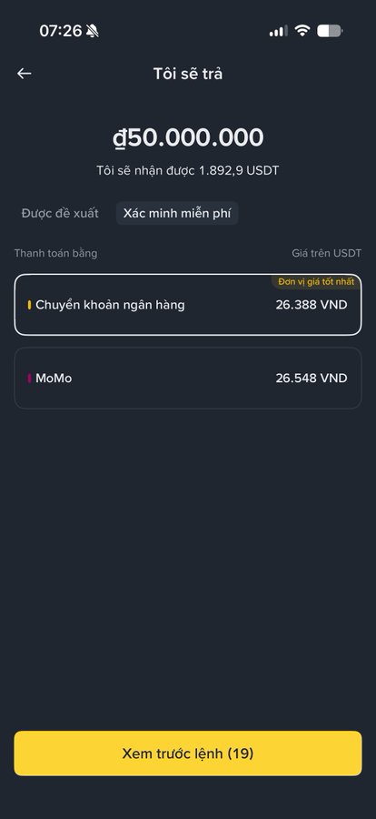 A Vietnamese-language crypto withdrawal screen showing a repayment of ₫50,000,000 (~1,892.9 USDT) with payment options including bank transfer (26,388 VND) and MoMo (26,548 VND), labeled with current USDT price.