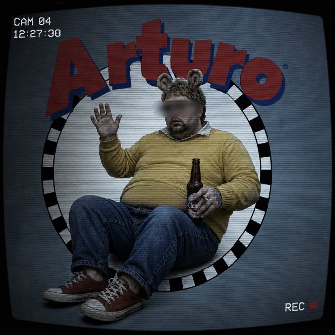 A man wearing bear ears, a yellow sweater, and jeans holds a beer bottle while sitting against a checkered 'Arturo' logo backdrop, styled like a security camera recording with 'CAM 04 12:27:38 REC' overlay.