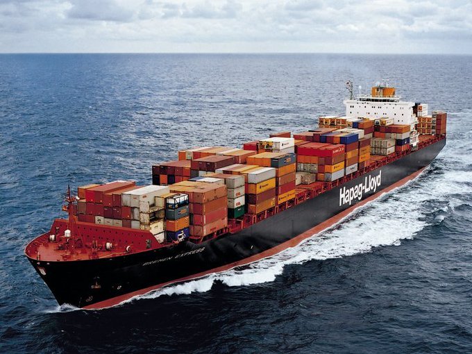 A massive Hapag-Lloyd container ship cuts through deep blue ocean waters, its hull emblazoned with the shipping giant's distinctive name and packed with rows of multicolored cargo containers from bow to stern.

The image of this Hapag-Lloyd vessel symbolizes real-world shipping logistics and ownership, contrasting with the post's message about $SHIP and EthraShip offering governance-based participation rather than traditional ownership of shipping assets.