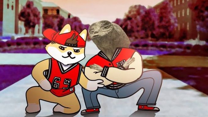 The image features two cartoonish dog characters, one wearing a red jersey with the number "63", and the other dressed in a blue jacket with a rock head. They are both posing for the camera while standing on a sidewalk or street. The background includes buildings and trees, creating an urban setting that complements the cartoon-like appearance of the dogs.