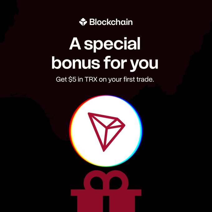 A digital advertisement for Blockchain.com offers "A special bonus for you" to "Get $5 in TRX on your first trade," featuring a circular TRON logo.