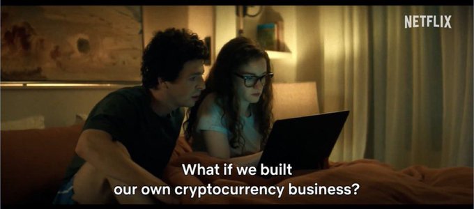 A Netflix scene showing a man and woman looking at a laptop in bed, with subtitles reading 'What if we built our own cryptocurrency business?'