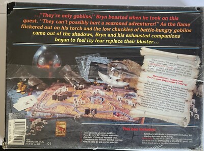 The image shows a box of a board game with a map, which appears to be a strategy or roleplaying game involving dragons. The back of the box features a list of items that can be used during gameplay, including cards, dice, and miniatures. The text on the box indicates that the game is currently in production and available for purchase at stores.