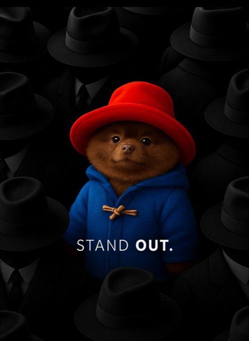 A teddy bear in a red hat and blue coat stands out boldly among a crowd of shadowy figures wearing identical black hats and suits, with the caption "STAND OUT." The image visually reinforces the post's message about choosing an overlooked, undervalued crypto coin rather than following the popular crowd, emphasizing individuality and the courage to back an underappreciated asset with massive potential.