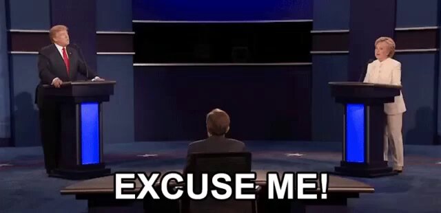 The image shows a political debate between two people standing behind podiums at a stage with blue walls. One person is wearing a suit while the other has a white dress. The text "Excuse me, me!" is written above them, indicating that they are interrupting each other during their exchange of ideas. The caption below the image reads: "Tbh, need to admit that @citrea_xyz did a great move with Alpha! I mean Alpha users will claim same time as Degens from the chain... But yesterday, @solsticefi users didn't have that advantage... Team simply let Alpha eat first n dump it from $0,6".