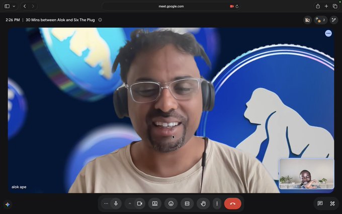 A Google Meet video call screenshot showing a smiling man wearing headphones and glasses, with the meeting titled '30 Mins between Alok and Six The Plug' and participant 'alok ape'.