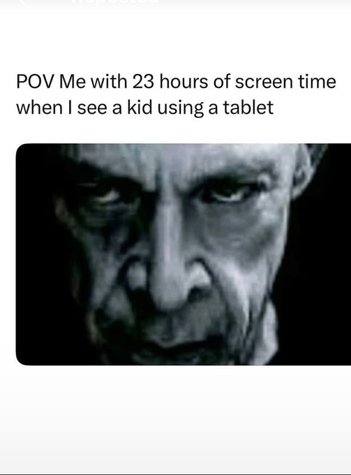 A meme captioned 'POV Me with 23 hours of screen time when I see a kid using a tablet' featuring a menacing close-up of a pale, scarred man's face with an angry expression.