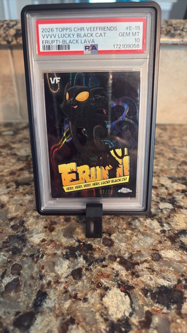 A graded PSA 10 2026 Topps Chrome Veefriends card featuring 'Lucky Black Cat' / 'Erupti-Black Lava' as part of the 'Erupt' subset, numbered 7/10.