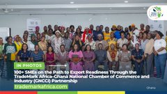 A large group photo of attendees at a conference, with text reading 'BREAKOUT 1: 100+ SMEs on the Path to Export Readiness Through the TOPS Trade Africa Program - Ghana National Chamber of Commerce and Industry (GNCCI) #Ready4TradeAfrica'.