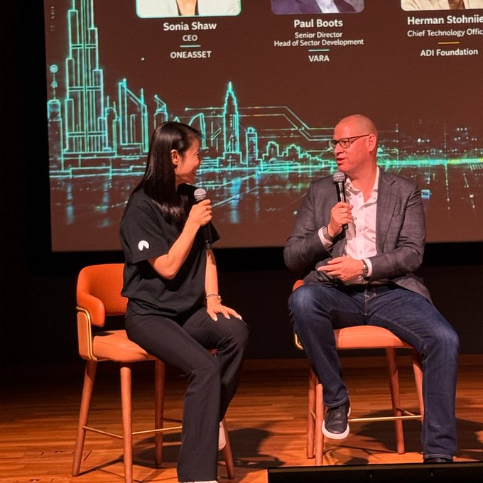 A panel discussion on stage featuring Sonia Shaw (CEO, ONEASSET) and Paul Boots (Senior Director, Head of Sector Development, VARA), with a third speaker Herman Stohnie (Chief Technology Officer, ADI Foundation) listed on the screen behind them.