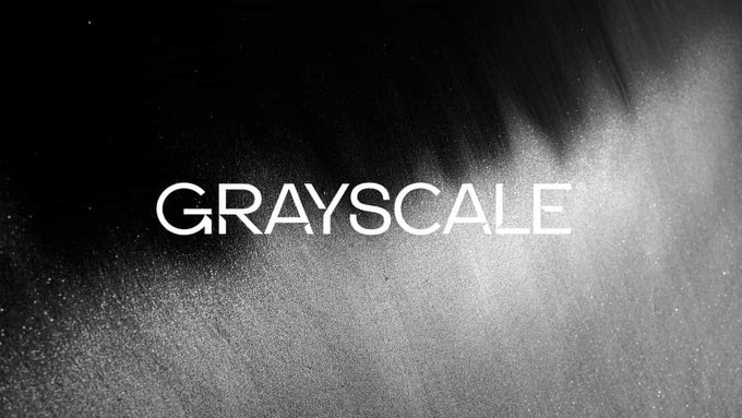 A Grayscale promotional image featuring the company name in white text against a dark, smoky, textured background.