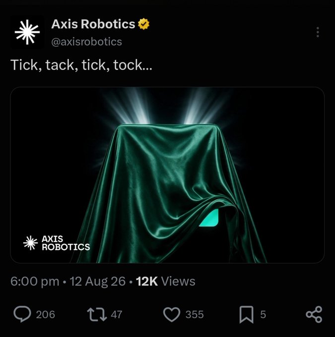 A social media post from Axis Robotics (@axisrobotics) showing a teal cloth-covered object with the caption 'Tick, tack, tick, tock...', posted at 6:00 pm on 12 Aug 26 with 12K views.