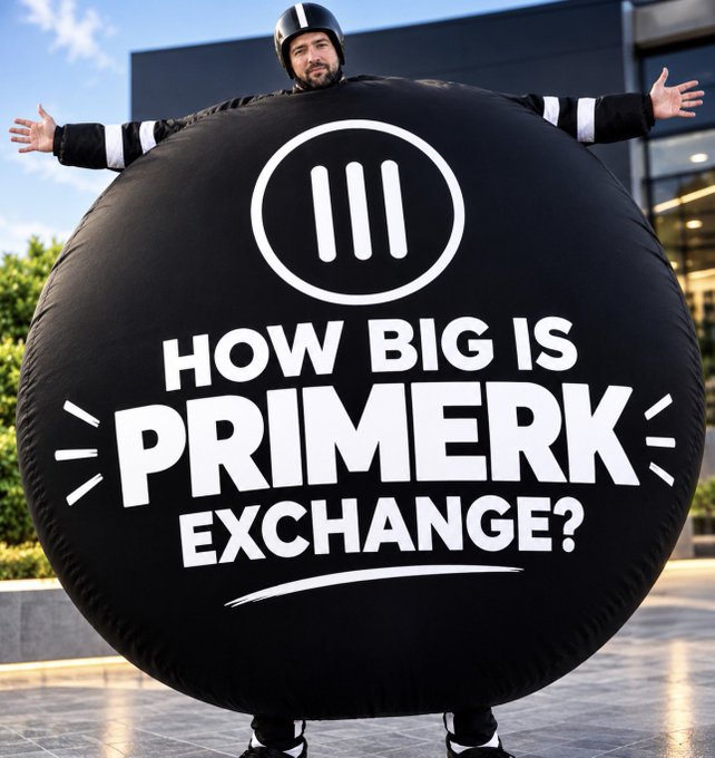 A person wearing a helmet stands behind a massive inflatable black sphere emblazoned with the text "HOW BIG IS PRIMERK EXCHANGE?" alongside a circular logo. The exaggerated size of the ball visually represents the caption's playful claim that Primerk Exchange is "VERY BIG."