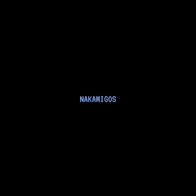 A black screen displays the word 'NAKAMIGOS' in small, light blue text in the center.
