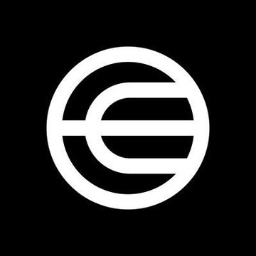 The image features a logo with the letter "E" inside a white circle surrounded by three vertical stripes. The background of the image is black, which further accentuates the contrast between the white "E" and the darker area around it. On this contrast, there's text from a recent post that reads, "BREAKING: $WLD is up 80% in the past week." The context suggests that the company has been experiencing some positive news or trends recently but wants to emphasize the increase in stock value.