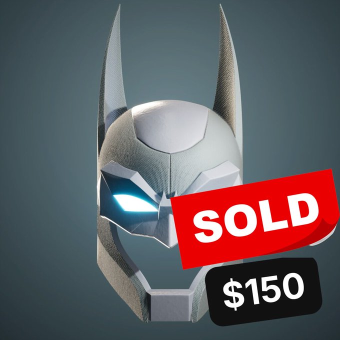 A white and gray Batman-style helmet with tall ears and glowing blue eyes, overlaid with a red 'SOLD' banner and a black '$150' price tag.