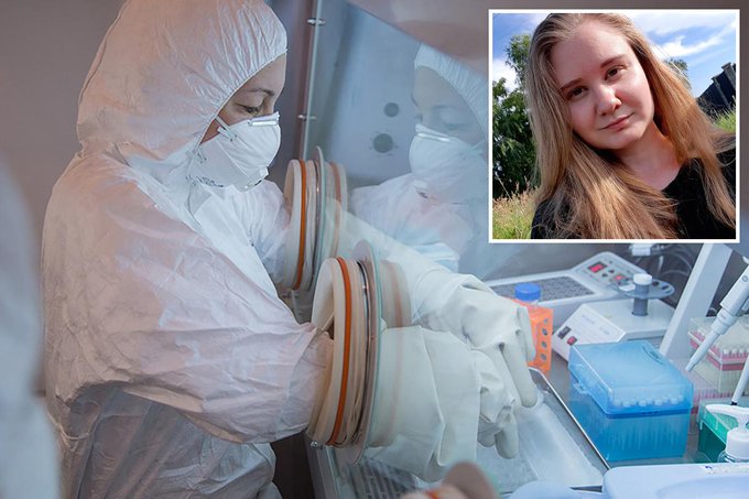Two researchers in white hazmat suits working with gloved isolation chambers and lab equipment, with an inset photo of a young blonde woman in the top right corner.