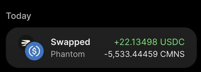 A cryptocurrency transaction notification showing 'Swapped' on Phantom: +22.13498 USDC received and -5,533.44459 CMNS spent.