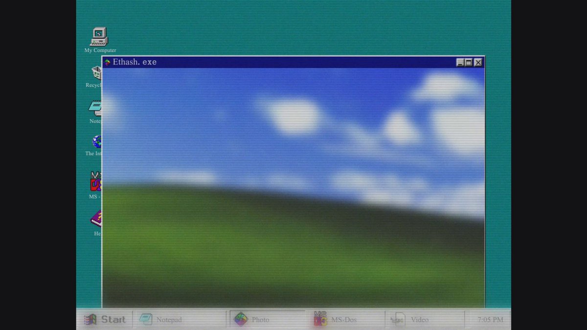 The image shows a computer screen with an old-fashioned desktop background featuring a green sky and grassy field. The text "Let's charge ahead, brothers!" is displayed at the bottom of the image. There are also several other images on the screen, including a picture of a computer monitor and icons for various applications such as "Start" and "Stop".