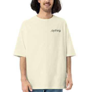 A person wears a cream-colored oversized T-shirt featuring the word "anything" printed in small black script on the chest. The shirt appears to be the "@anything x WAGMI House Goa" merch mentioned in the giveaway post.