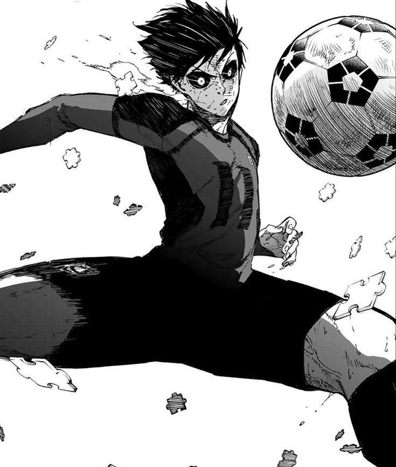 A black-and-white manga panel showing a young soccer player with spiky hair, intense eyes, and a dirt-smudged face, leaping to kick a soccer ball.