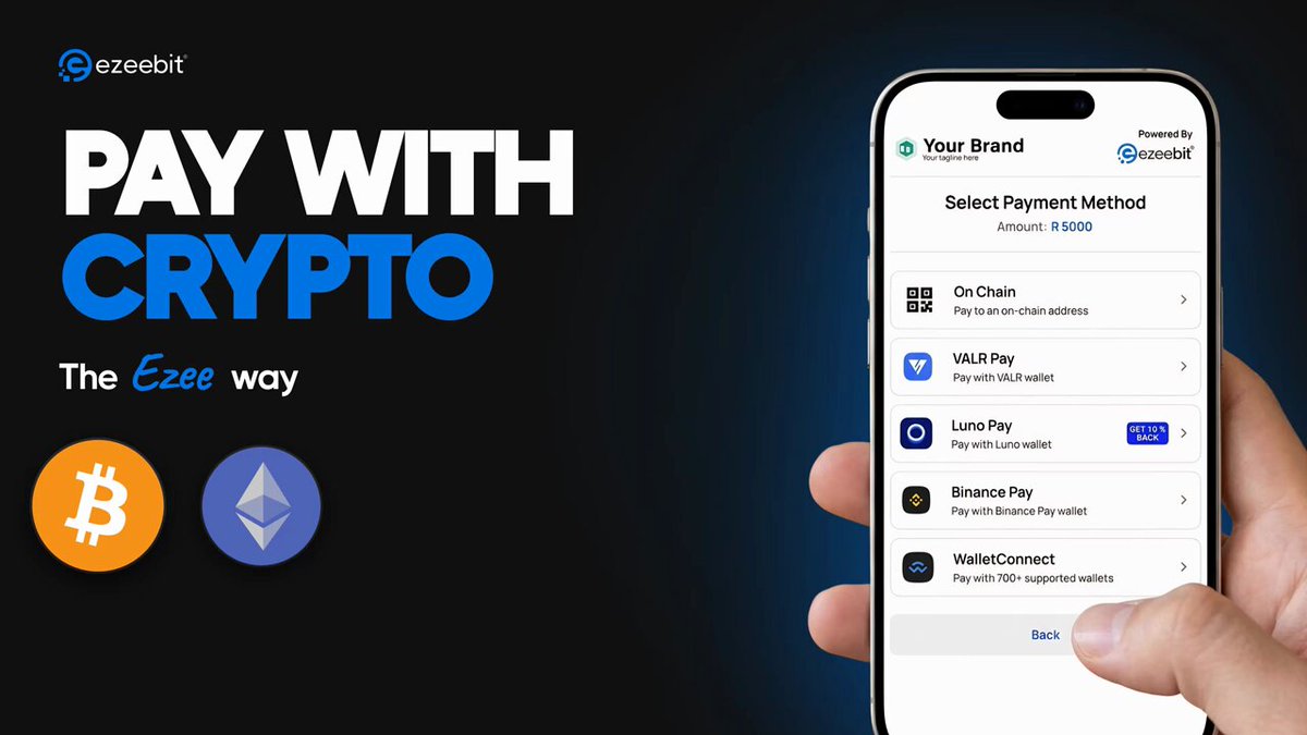 The image shows a person holding up their phone displaying an app that allows them to pay with cryptocurrency. The app has two options for payment methods - Bitcoin and Ethereum. The person's hand is visible, indicating they are actively using the app on their phone.