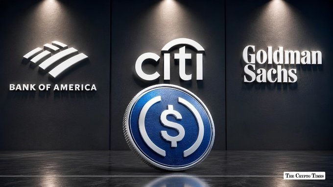 Image depicting major financial institutions including Bank of America, Citi, and Goldman Sachs logos displayed alongside a central digital USDC-style cryptocurrency coin, credited to 'The Crypto Times'.