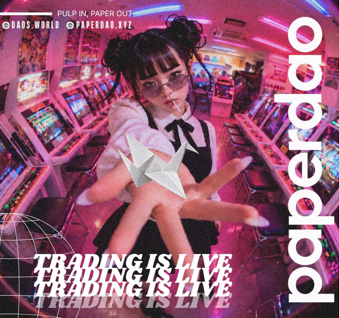 A promotional graphic with the text 'paperdao', 'PULP IN, PAPER OUT', 'TRADING IS LIVE', and social handles '@DAOS.WORLD @PAPERDAO.XYZ', featuring a young woman with twin buns in sunglasses holding an origami crane in an arcade setting.