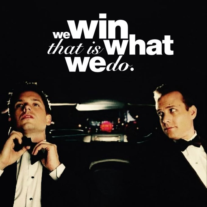 A still from a film showing two men in tuxedos in a car, with the overlaid text reading 'we win that is what we do.'