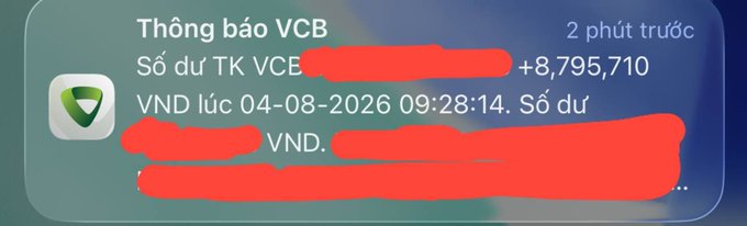 A smartphone notification screenshot from VCB (Vietcombank) showing an account balance of +8,795,710 VND as of 04-08-2026 at 09:28:14, with account details redacted in red.