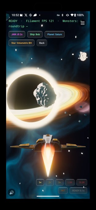A mobile screenshot of the space exploration game 'Filament' running at 121 FPS, showing a spaceship approaching a black hole near Saturn, with debug overlays displaying 'JAM JS 2s', 'roundtrip', 'Star: Volumetric BH', and various zoom level buttons.