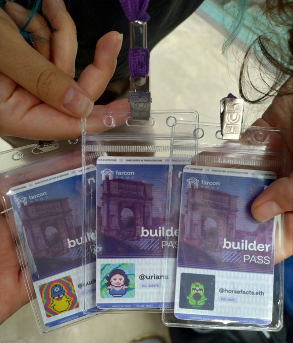 Photo of three people holding up Farcon Home 'Builder Pass' lanyards/event badges with different pixel art character designs and usernames like @uriana and @horsefacts.eth.