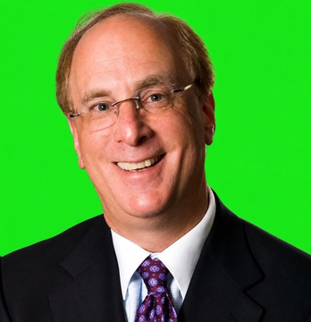 A professional headshot of a smiling middle-aged man with glasses, wearing a dark suit, white shirt, and purple patterned tie against a bright green background.