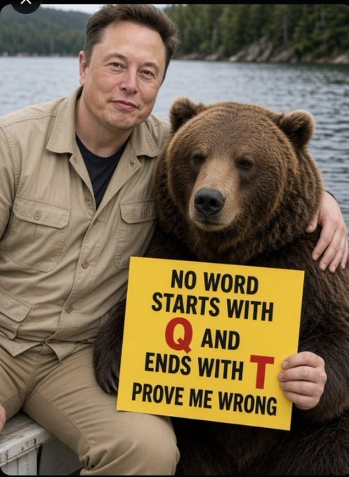 Elon Musk poses with a large brown bear holding a yellow sign that reads 'NO WORD STARTS WITH Q AND ENDS WITH T PROVE ME WRONG' by a lake.