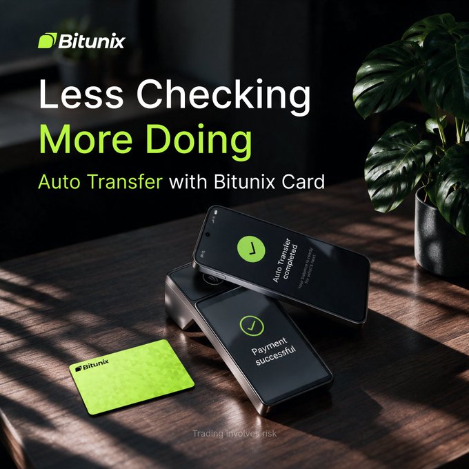 A Bitunix promotional graphic featuring the tagline "Less Checking, More Doing" and "Auto Transfer with Bitunix Card," showing a Bitunix card alongside two phones displaying "Auto Transfer completed" and "Payment successful" notifications on a wooden desk.

The image visually reinforces the post's message about the Bitunix Card's Auto Transfer feature, illustrating how the system automatically completes transactions so users don't have to manually check—aligning with the "Less Checking, More Doing" concept.