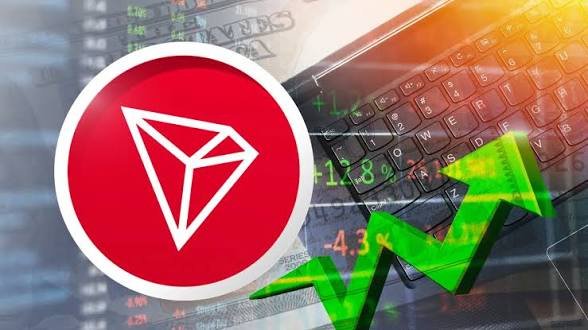 A red Tron (TRX) cryptocurrency logo over a keyboard background with a green upward-pointing arrow and stock/crypto data overlay.
