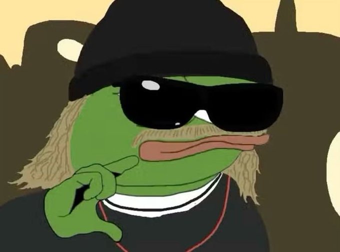 An illustration of a green Pepe the Frog character wearing a black beanie, black sunglasses, and a black shirt, with blonde hair and a chain necklace, pointing a finger upward.