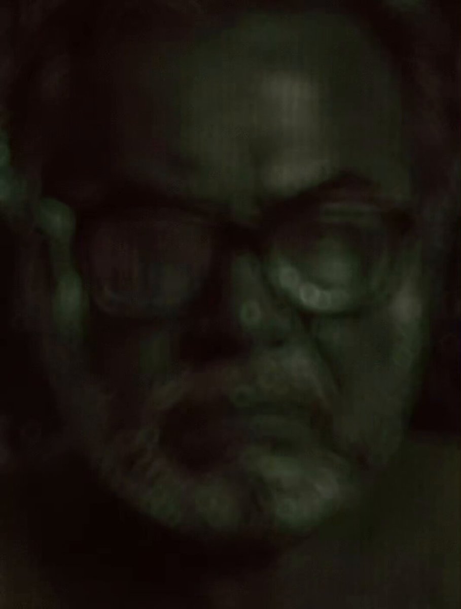 The image shows a close-up of a man's face with glasses, likely a photograph or selfie. There are also blurred elements surrounding the subject of the photo, possibly indicating movement or activity. The image seems to be related to a post on social media, as the caption includes text that may read things like "$15 Sol Giveaway -- Ends in 6 hours! 3 Winners Total: 2 Verified Accounts 1 Non-Verified Account Follow @AngryUncleToken Like & Repost this post Drop your SOL wallet below Good luck everyone". The overall tone of the image is mysterious, drawing attention to the man and his glasses.