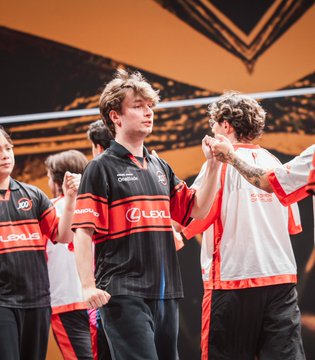 Players from 100 Thieves celebrate a victory in their team jerseys, contrasting with the text's commentary on market skepticism regarding their performance.