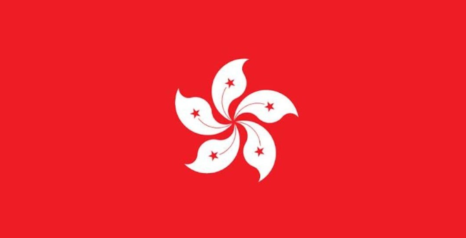 The image displays the flag of Hong Kong, featuring a white five-petal Bauhinia flower with red stars on a red background, directly representing the location of the bank bribery case described.