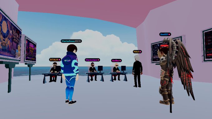 A screenshot from a virtual reality/metaverse environment showing multiple avatars (including CharlesRazon0015, GITALIK, CharlesRazon, another Gitalik, and FOLK) gathered in a virtual room with screens displaying artwork, where one avatar appears to be winged.