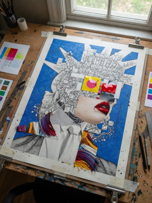 An artist's workspace showing a mixed-media artwork in progress featuring a detailed line drawing of a figure with a sunburst crown, partially colored with blue backgrounds and yellow/red tassels, with red lips as a collage element, surrounded by tools and color swatches.