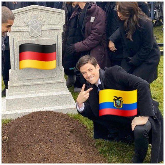 A man in a suit kneels beside a tombstone marked with a German flag, smiling and giving a peace sign while holding an Ecuadorian flag, humorously mourning his failed bet on Germany. The meme captures the post's lament about losing a prediction on Germany against Ecuador on Polymarket during the World Cup.