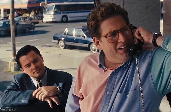 A meme showing Leonardo DiCaprio leaning on a car while Jonah Hill talks on a payphone in the background, with an 'imgflip.com' watermark.