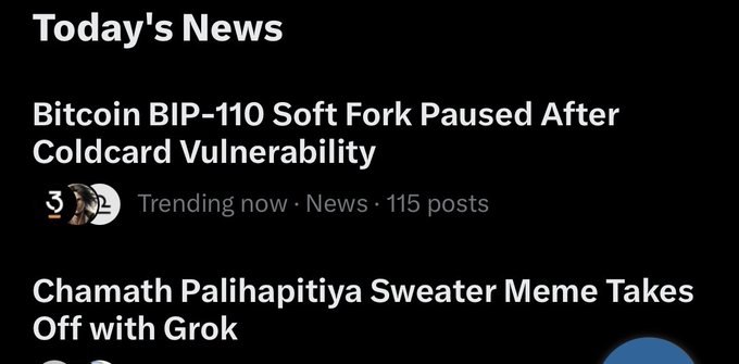 A screenshot of today's news shows the headline "Bitcoin BIP-110 Soft Fork Paused After Coldcard Vulnerability" trending with 115 posts, alongside a second story about a Chamath Palihapitiya sweater meme. The image relates to the post by highlighting the same BIP-110 news story being praised by the author, who commends the BIP-110 team's responsible decision to pause the soft fork after the Coldcard vulnerability was discovered.