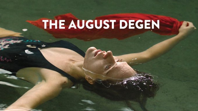 A cinematic still showing a woman in a black dress floating in dark green water, holding a red cloth, with the text 'THE AUGUST DEGEN' overlaid in white.