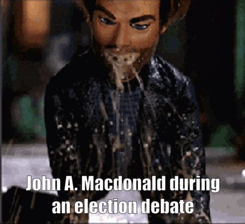 The image features a man with a beard wearing a black jacket who appears to be spewing out water or saliva from his mouth. The caption below the image reads "John A. Macdonald during an election debate", which suggests that this scene is related to a political event, possibly a debate between two candidates.